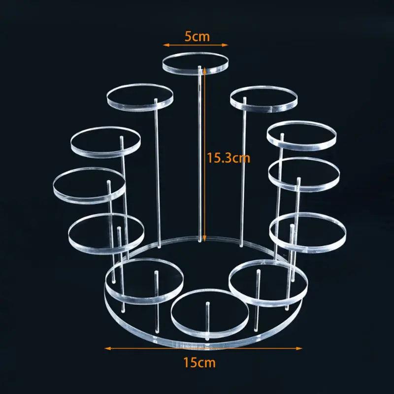 Clear acrylic display stand neatly organizing and displaying a collection of figurines, miniatures, and other small keepsakes.