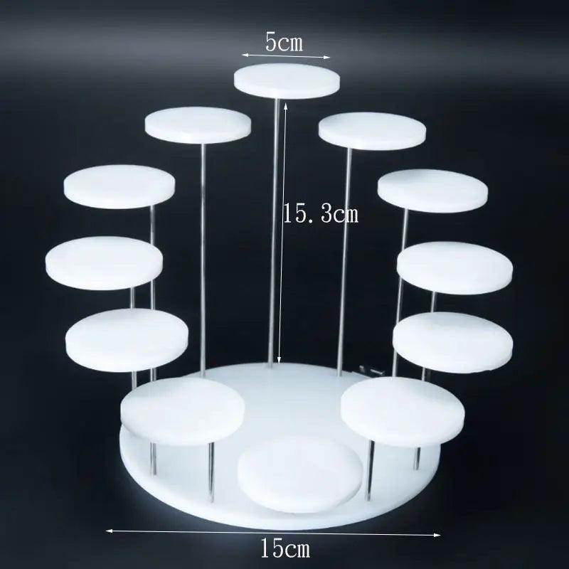 Clear acrylic display stand neatly organizing and displaying a collection of figurines, miniatures, and other small keepsakes.