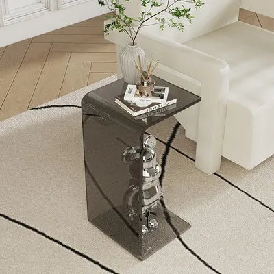 Small acrylic side table next to sofa