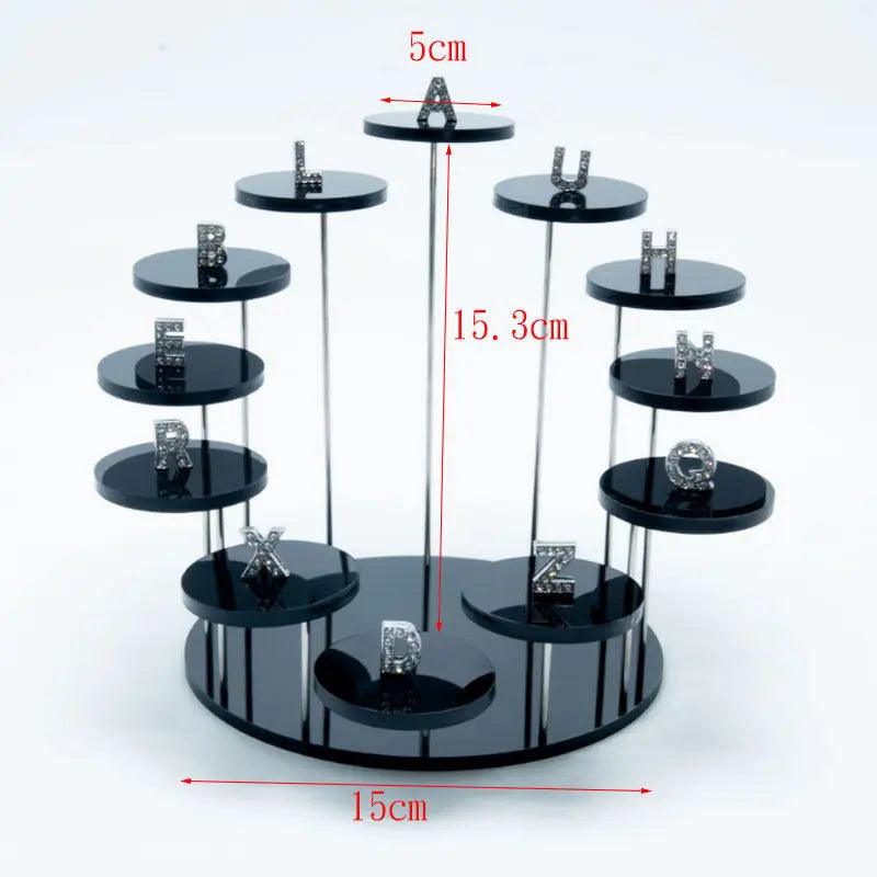 Clear acrylic display stand neatly organizing and displaying a collection of figurines, miniatures, and other small keepsakes.